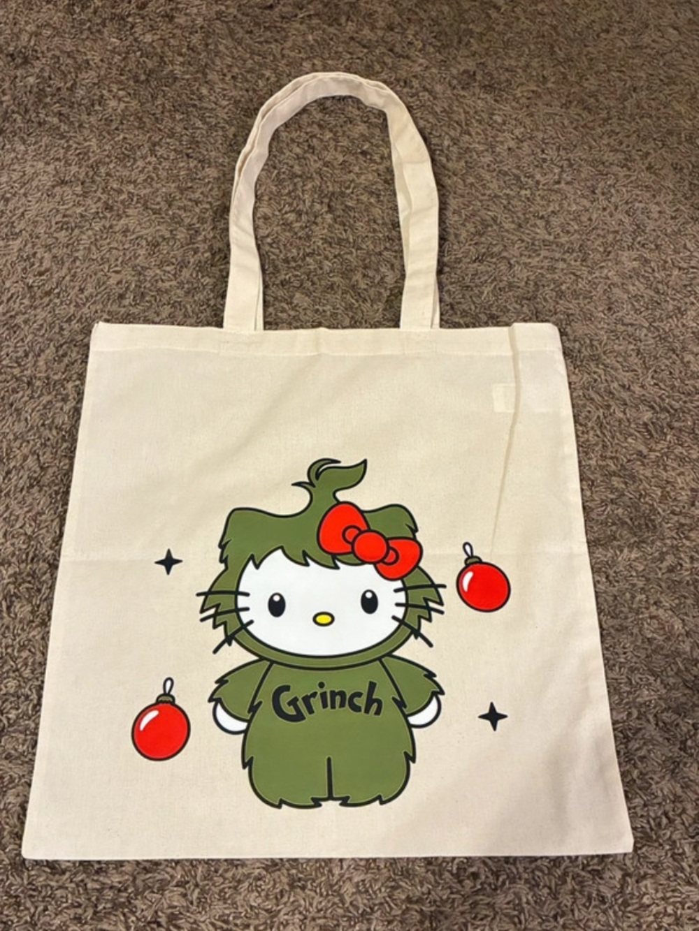 Cream Canvas Tote with Green Grinch Hello Kitty Print